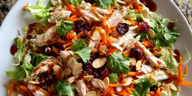 A beautifully plated Cranberry Chicken Salad Delight with vibrant colors, garnished with fresh greens.