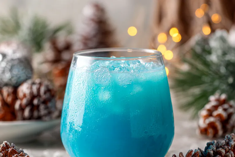 Colorful ingredients for Frostbite Blue Christmas Punch